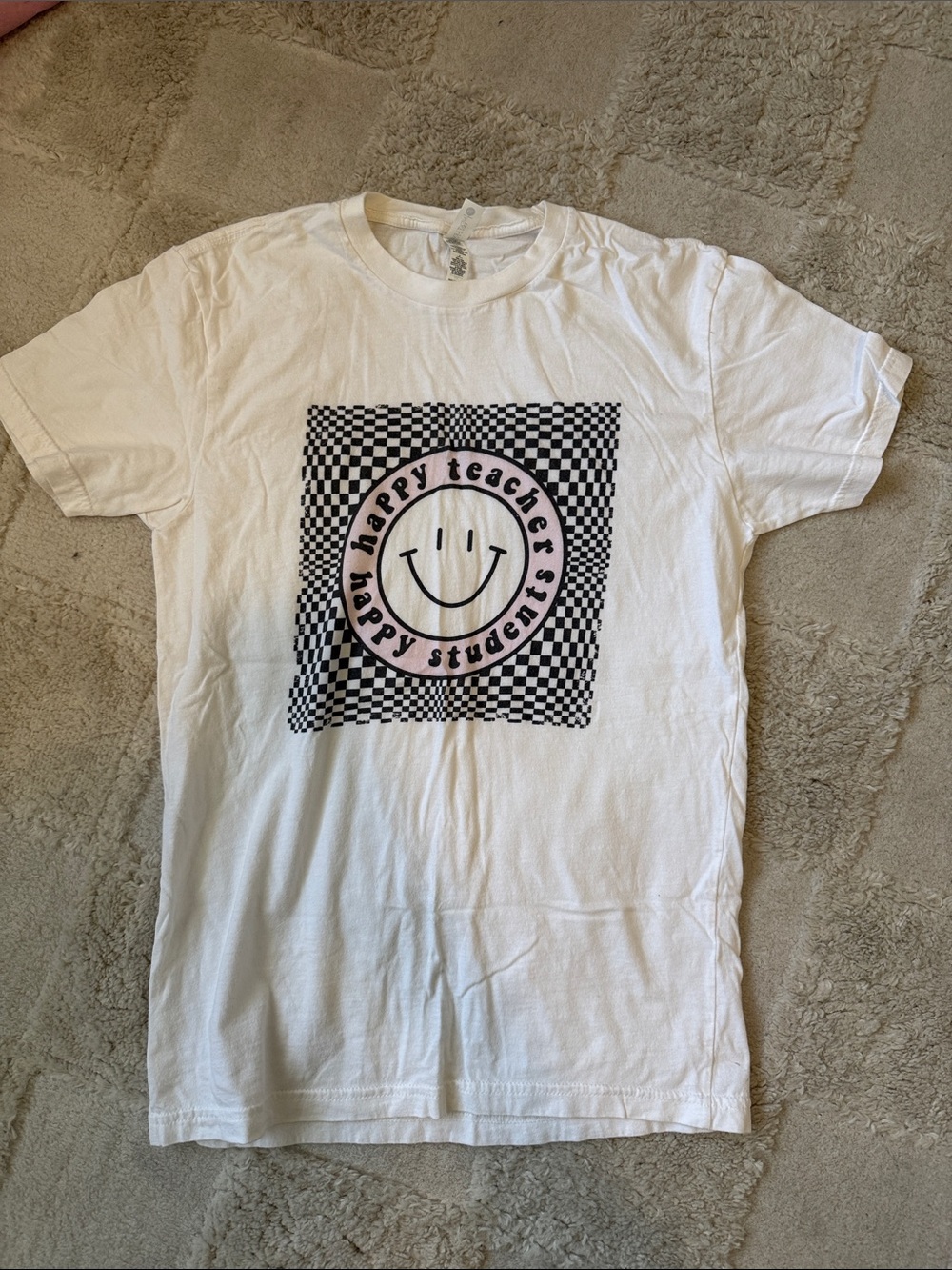 Next Level Apparel White Tee with Black Checkerboard Smile Graphic